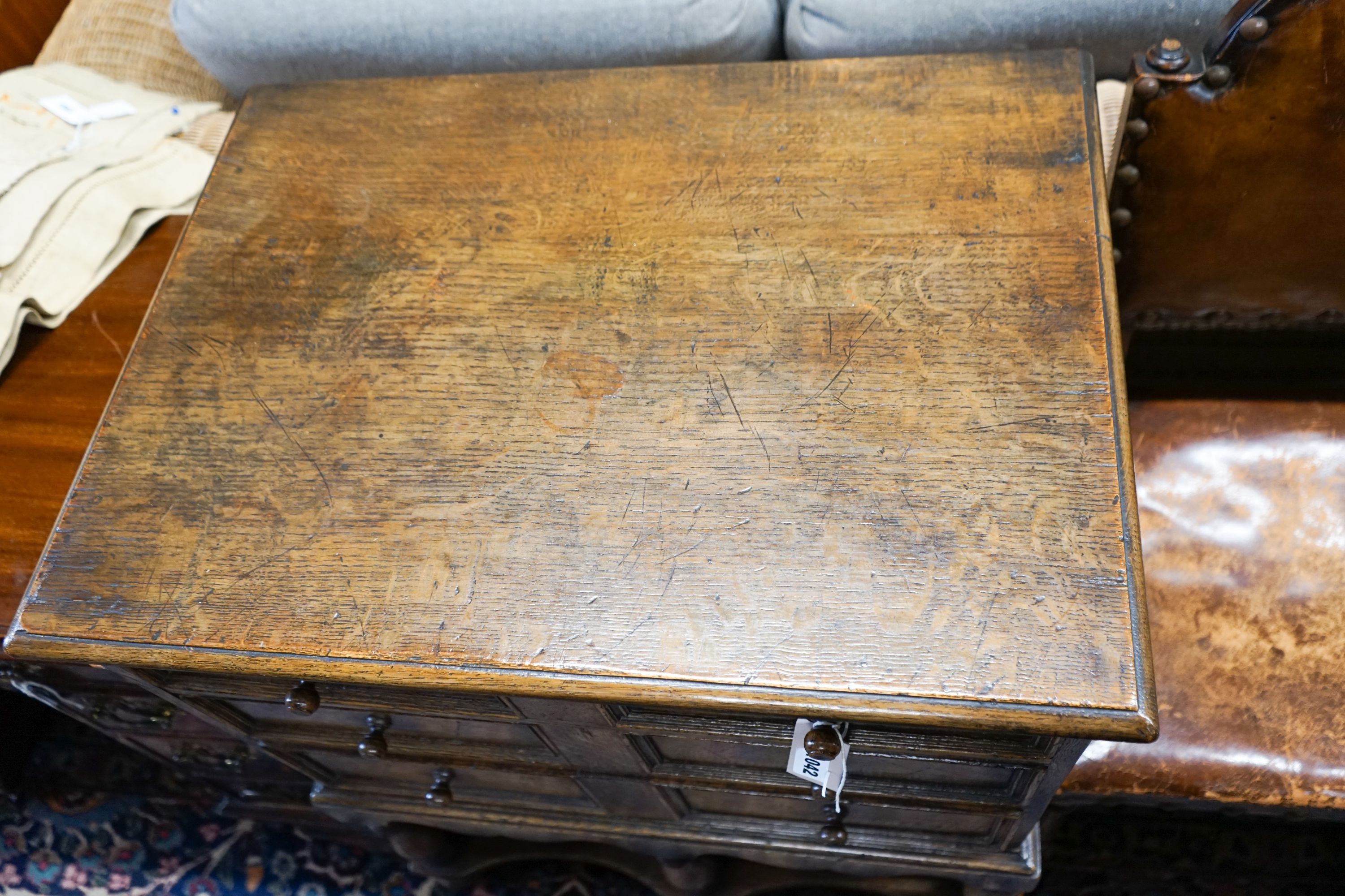 A 17th century style small oak chest on stand